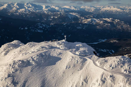 Whistler Mountain, BC, Canada, from an aerial perspective. Picture taken during a cloudy winter sunset.の写真素材