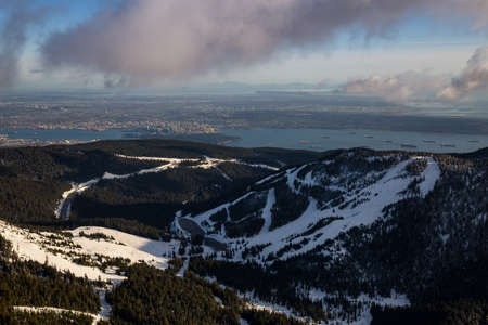Cypress Mountain from an aerial perspective with Vancouver City, BC, Canada, in the background.の写真素材