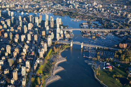 Beautiful Aerial View of Vancouver Downtown, British Columbia, Canada, during a bright spring sunset.の写真素材