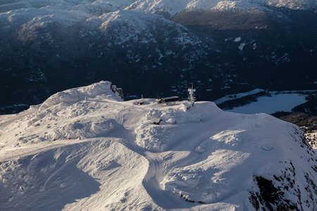 Whistler Mountain, BC, Canada, from an aerial perspective. Picture taken during a cloudy winter sunset.の写真素材