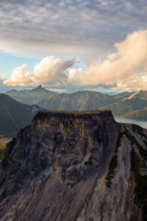 Aerial landscape view of Table Mountain with Black Tusk in the background. Picture taken in Garibaldi, BC, Canada, during a cloudy sunset.の写真素材
