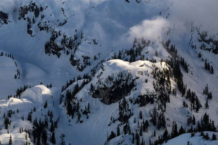 Aerial landscape view of the snow covered mountain range North of Vancouver, British Columbia,...