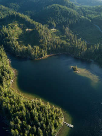 Aerial landscape view of Alice Lake during a vibrant sunny summer day. Located in Northern Vancouver...