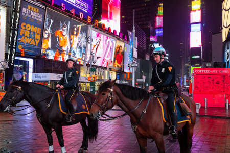 Manhattan, New York, NY, United States - October 27, 2018: Mounted Police patrolling the night in Times Square.のeditorial素材