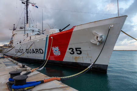Key West, Florida,  States - November 2, 2018: View of Coast Guard Ship Destroyer at Truman Waterfront Park during a cloudy sunrise.のeditorial素材
