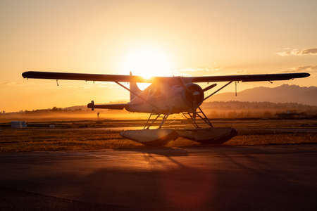 Seaplane parked at the airport during a vibrant summer sunset. Taken in Pitt Meadows, Greater Vancouver, BC, Canada.の写真素材