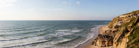 Beautiful Panoramic View on the Ocean Coast duing a vibrant sunset at the Apollonia Beach. Taken in...