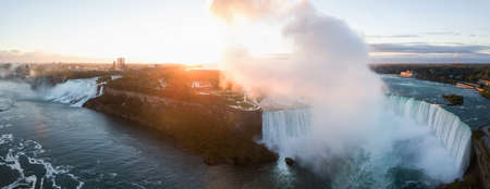 Beautiful aerial panoramic view of Niagara Falls during a vibrant sunrise. Located near Toronto, Ontario, Canada.の写真素材