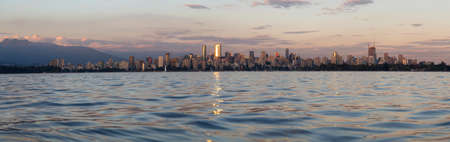 Downtown Vancouver Skyline during a vibrant summer sunset. Located in British Columbia, Canada.