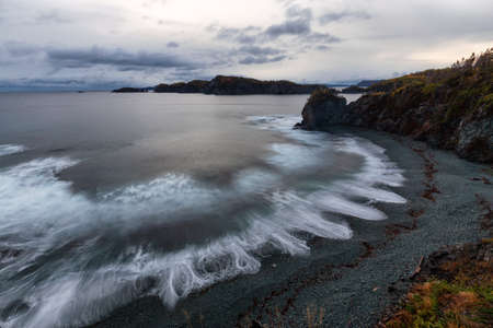 Striking landscape view of a rocky Atlantic Ocean Coast during a vibrant sunrise. Taken at...