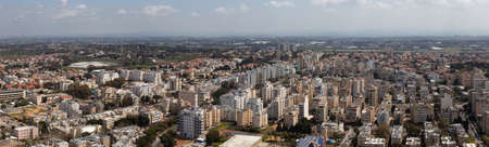 Aerial panoramic view of a residential neighborhood in a city during a cloudy and sunny day. Taken...