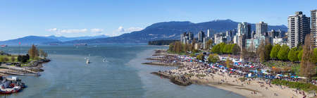 Downtown Vancouver, British Columbia, Canada - April 20, 2019: Aerial view of Crowd of people gathered to celebrate 420 at Sunset Beach during a sunny day.のeditorial素材