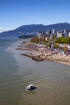 Downtown Vancouver, British Columbia, Canada - April 20, 2019: Aerial view of Crowd of people gathered to celebrate 420 at Sunset Beach during a sunny day.のeditorial素材