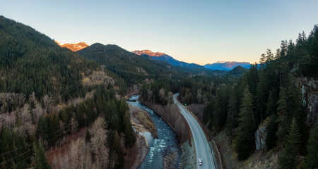 Aerial Panoramic View of the Famous Scenic Drive, Sea to Sky Highway, during a colorful sunrise. Located between Squamish and Whistler, North of Vancouver, British Columbia, Canada.の写真素材