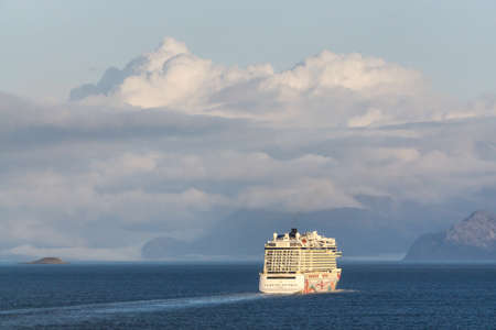 Glacier Bay National Park and Preserve, Alaska, USA - September 25, 2019: Norwegian Cruise Ship is cuising in the Ocean during a cloudy and sunny morning in fall season.のeditorial素材