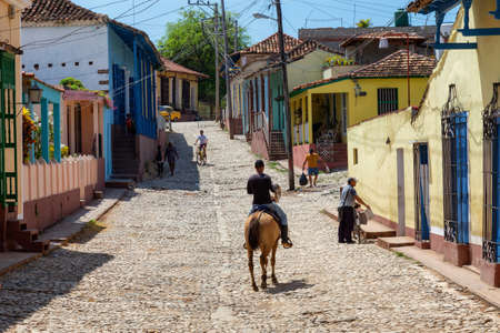 Trinidad, Cuba - June 6, 2019: Horse Carriage in the streets of a small Cuban Town during a vibrant sunny day.のeditorial素材