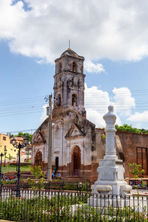 Trinidad, Cuba - June 6, 2019: Street View of an old Church in a small touristic Cuban Town during a vibrant sunny day.のeditorial素材