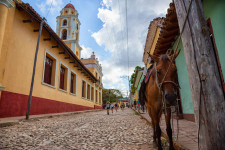 Trinidad, Cuba - June 6, 2019: Horse Carriage in the streets of a small Cuban Town during a vibrant sunny day.のeditorial素材