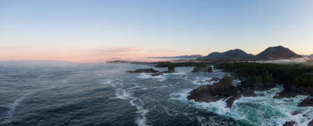 Ucluelet, Vancouver Island, British Columbia, Canada. Aerial Panoramic View of a Small Town near Tofino on a Rocky Pacific Ocean Coast during a cloudy and colorful morning sunrise.の写真素材