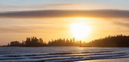 Long Beach, Near Tofino and Ucluelet in Vancouver Island, BC, Canada. Beautiful panoramic view of a sandy beach on the Pacific Ocean Coast during a vibrant sunset.の写真素材