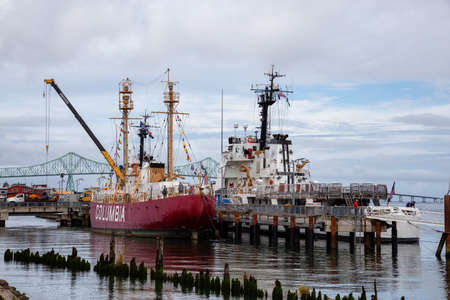 Astoria, Oregon, United States - September 9, 2019: Boats parked at the marina on Columbia River during a cloudy summer morning.のeditorial素材