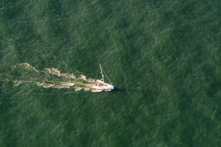 Aerial View of a Sail Boat in Howe Sound, near Vancouver, BC, Canada, during a sunny summer day.