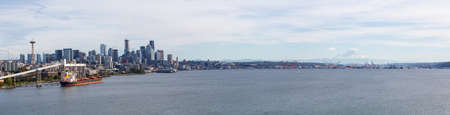 Downtown Seattle, Washington, United States of America. Aerial Panoramic View of the Modern City on the Pacific Ocean Coast during a sunny and cloudy Autumn Day.の写真素材