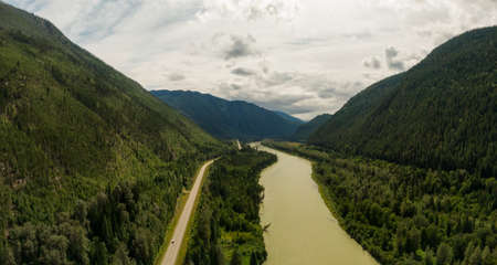 Aerial Panoramic View of a Scenic Highway in the Valley surrounded by Canadian Mountain Landscape. Taken near Clearwater, North of Kamloops, British Columbia, Canada.の写真素材