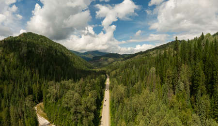Aerial Panoramic View of a Scenic Highway in the Valley surrounded by Canadian Mountain Landscape. Taken near Salmo, British Columbia, Canada.の写真素材