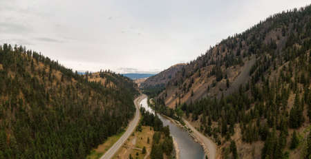 Aerial Panoramic View of a scenic Highway in the Valley surrounded by Canadian Mountain Landscape. Taken near Princeton, British Columbia, Canada.の写真素材