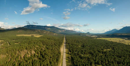 Aerial Panoramic View of a Scenic Highway in the Valley surrounded by Canadian Mountain Landscape. Taken in Kootenay near Canal Flats, British Columbia, Canada.の写真素材