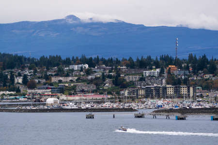 Campbell River, Vancouver Island, British Columbia, Canada - September 27, 2019: View of a City on the ocean shore during a cloudy evening.の写真素材