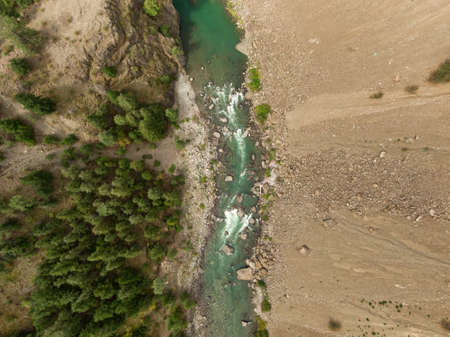 Aerial View from Above of a beautiful Green River running in the valley during a summer day. Taken near Lillooet, British Columbia, Canada.の写真素材