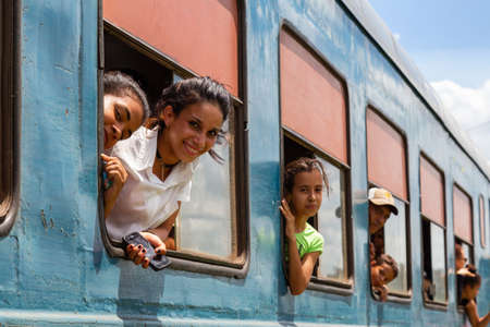 Ciego de Avila, Central Cuba - June 14, 2019: Cuban People are waiting for the Train after an Accident in a small Town during a cloudy and sunny summer day.のeditorial素材