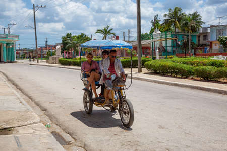 Ciego de Avila, Central Cuba - June 14, 2019: Urban Street view of a small Cuban Town during a cloudy and sunny summer day.のeditorial素材