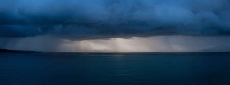 Beautiful Panoramic View of American Mountain Landscape on the Ocean Coast during a cloudy and rainy...