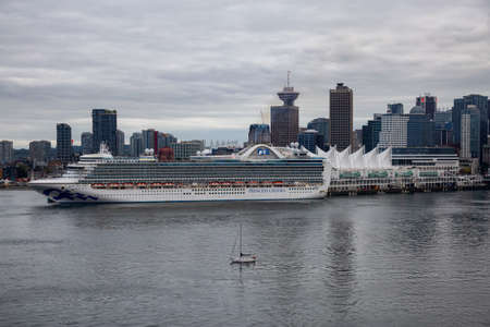 Vancouver, British Columbia, Canada - September 21, 2019: Cruise Ship Parked at Canada Place in Coal Harbour during a cloudy summer evening.のeditorial素材