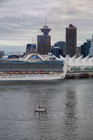 Vancouver, British Columbia, Canada - September 21, 2019: Cruise Ship Parked at Canada Place in Coal Harbour during a cloudy summer evening.のeditorial素材