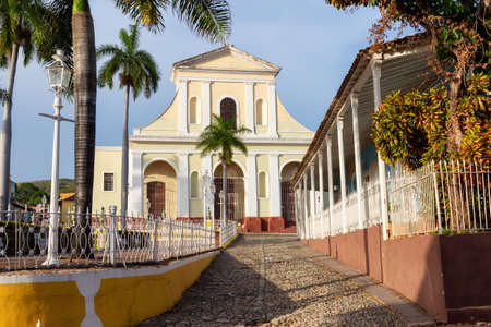 Beautiful View of a Catholic Church in Plaza Mayor during a colorful sunset. Taken in Downtown Trinidad, Cuba.の写真素材