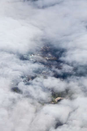 Aerial View from Above of a beautiful rocky beach covered in Clouds and Fog at the West Pacific Ocean Coast. Taken near Tofino and Ucluelet in Vancouver Island, BC, Canada.の写真素材