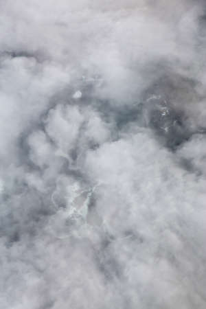 Aerial View from Above of a beautiful rocky beach covered in Clouds and Fog at the West Pacific Ocean Coast. Taken near Tofino and Ucluelet in Vancouver Island, BC, Canada.の写真素材