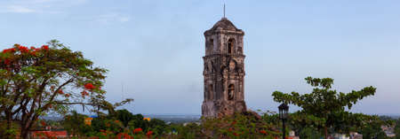 Panoramic View of a Church in a small touristic Cuban Town during a vibrant sunny sunrise. Taken in Trinidad, Cuba.の写真素材