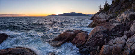 Beautiful Panoramic view of a rocky ocean coast during a vibrant sunny sunset. Taken in Lighthouse Park, Horseshoe Bay, West Vancouver, British Columbia, Canada.の写真素材