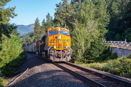 White Salmon, Washington, United States - June 30, 2019: Commercial Train riding in Columbia River...
