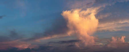 Panoramic View of a Dramatic Cloudscape during colorful sunrise.