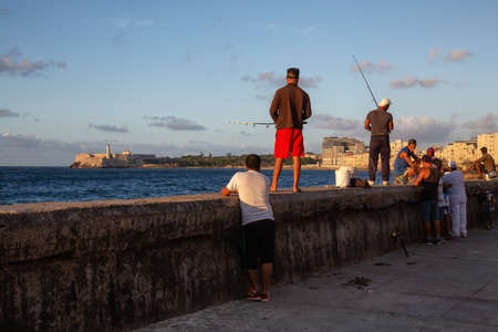 Havana, Cuba - May 22, 2019: Cuban people are fishing in the ocean, taken during the Shortage of Food Crisis.のeditorial素材