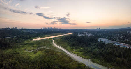 Aerial panoramic view of Burnaby Lake in the modern city during a vibrant summer sunset. Taken in Vancouver, BC, Canada.の写真素材