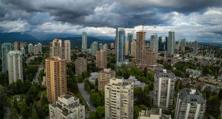 Aerial Panoramic view of residential homes in a modern city during a vibrant summer cloudy day. Taken in Burnaby, Vancouver, BC, Canada.の写真素材