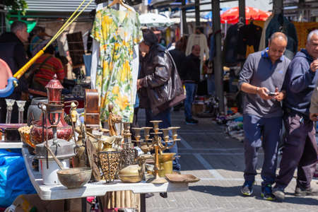 Jaffa, Tel Aviv, Israel - April 3, 2019: People selling merchandise in the streets during a sunny...
