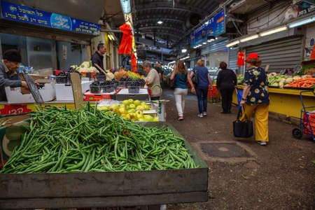 Petah Tikva, Center District, Israel - April 3, 2019: People shopping at an Old Market Place in the city.のeditorial素材